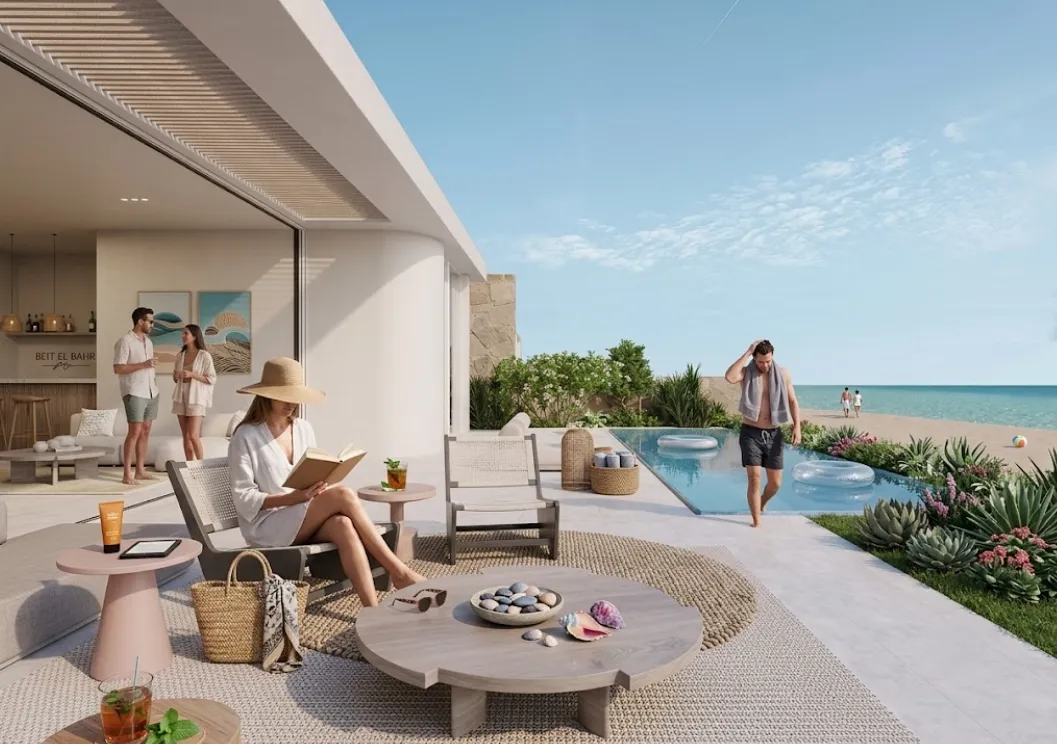 A modern Mediterranean-style villa terrace overlooking a private pool and the sea beyond